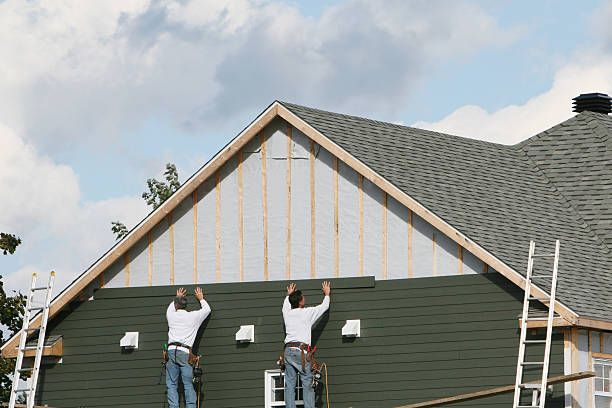 Professional Storm Damage Siding Repair technician working in Thorndale, TX